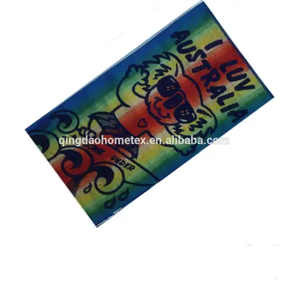 Beach towel featuring a cartoon koala wearing sunglasses on a rainbow background with the text I LUV AUSTRALIA