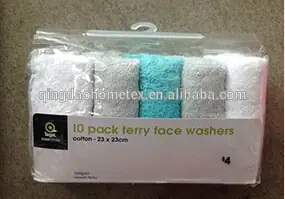 Packaged set of 10 terry face washers in white and turquoise colors.