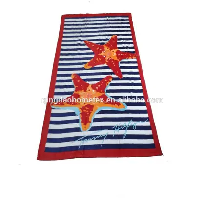 Striped beach towel featuring two large starfish designs on a white background