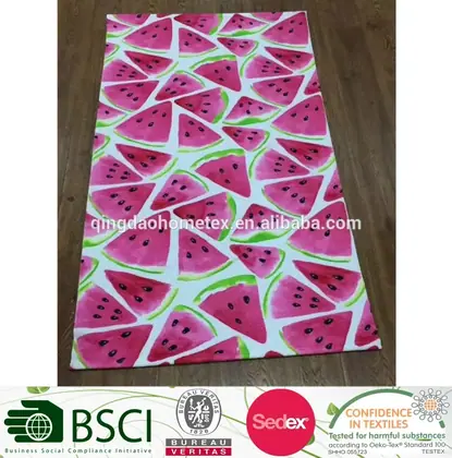 Green and red watermelon design printed on a 100% cotton velour beach towel, 28x58 inches, laid flat