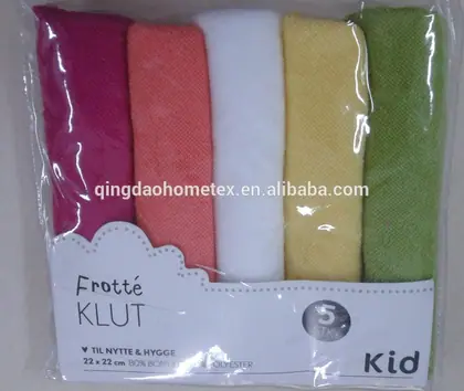 Package containing five folded terry cloth washcloths in magenta, coral, white, yellow, and green.