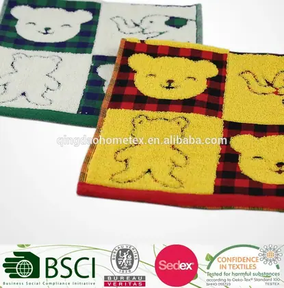 Two children's checkered towels with appliqued teddy bear and duck motifs in green, white, yellow, and red
