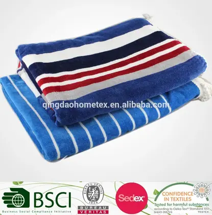 Two folded striped beach towels, one navy with red, white and gray stripes and one blue with thin white stripes