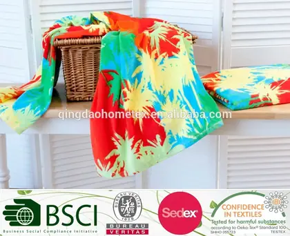 Colorful tropical palm-print beach towels draped over a wicker basket, with BSCI, Bureau Veritas, Sedex and OEKO-TEX certification logos below