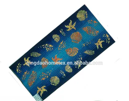 Printed beach towel with blue stripes and seashell and starfish pattern, shown diagonally with BSCI and Oeko-Tex logos below
