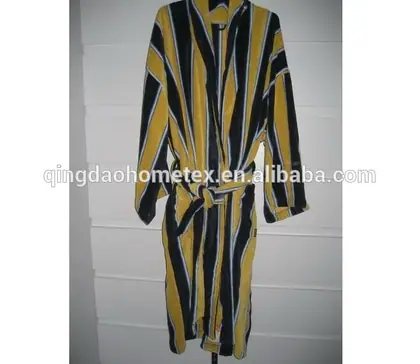 Yellow and black striped robe hanging against a white wall with a belt tie