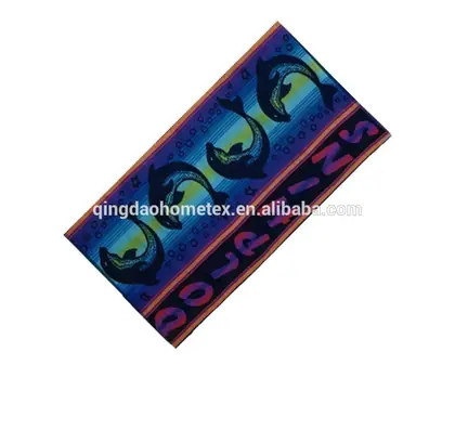 Colorful beach towel with dolphin print and 'DOLPHINS' text, shown tilted on white background