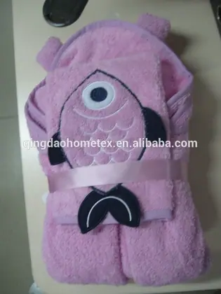 Pink hooded baby towel with embroidered fish design, folded and tied with a ribbon