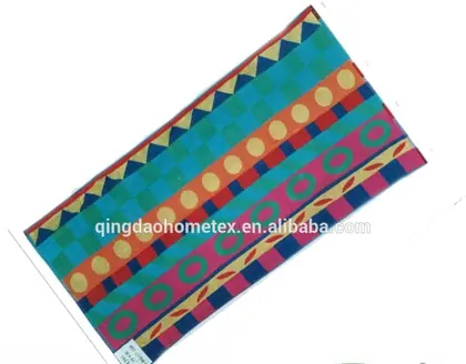 Colorful patterned beach towel with geometric designs, shown diagonally with BSCI and Oeko-Tex certification logos below