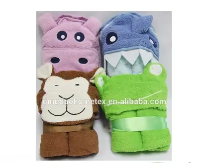 Four animal-themed hooded towels (hippo, shark, monkey, frog) folded and tied with ribbons