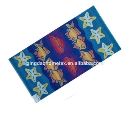 Printed beach towel with fish and starfish patterns in blue, yellow, and red on a white background