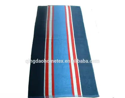 Striped beach towel in navy and light blue with red and white vertical stripes