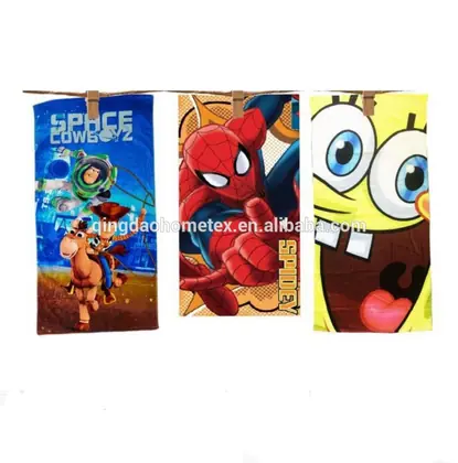 Three printed beach towels on a line featuring cartoon characters including a space ranger, a superhero, and a yellow sponge character