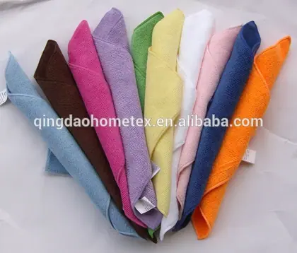 Fan of folded microfiber cleaning towels in various colors on a white background