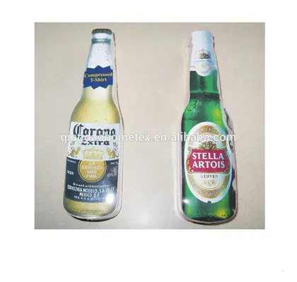 Two inflatable bottle-shaped items printed with Corona Extra and Stella Artois branding on a beige surface