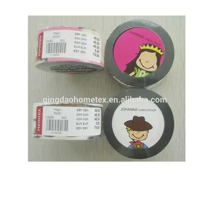 Four rolls of decorative tape with cartoon girl and boy labels, one roll showing a price list sticker