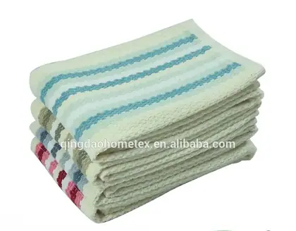 Stack of folded striped kitchen towels in cream, blue, and multicolor designs on a white background