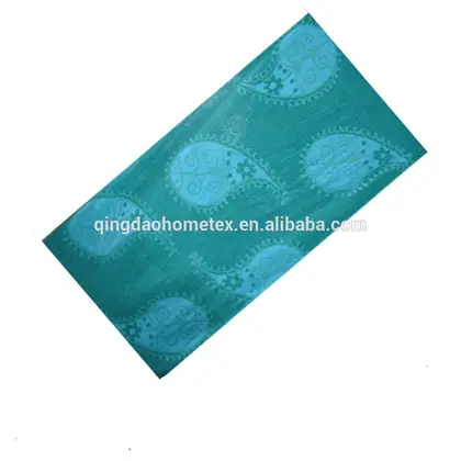 Teal fabric with light blue paisley pattern shown diagonally on a white background