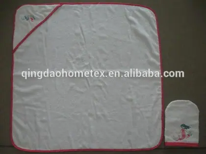 White baby hooded towel with pink trim and embroidered mermaid design, shown with matching matching wash mitt