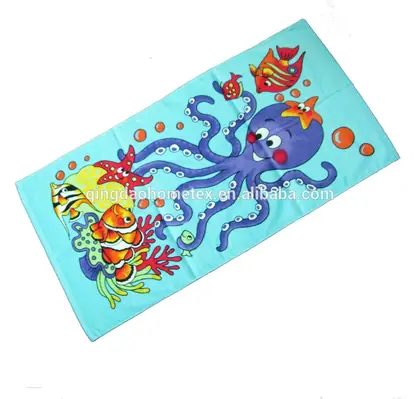 Turquoise beach towel with a cartoon purple octopus, clownfish and starfish print, shown at an angle on a white background