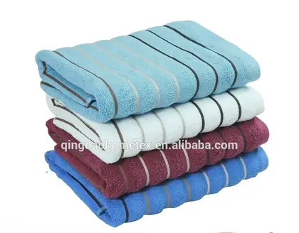 Stack of folded striped towels in blue, white, and burgundy with BSCI and Confidence in Textiles certification logos below