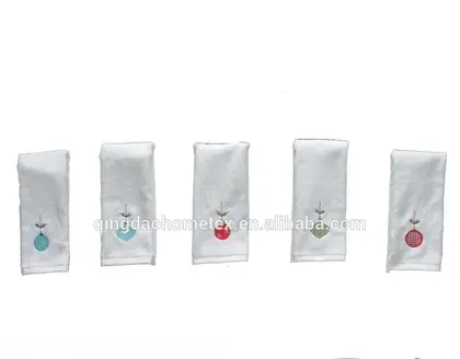 Five white towels with small embroidered motifs in different colors on a plain background, with BSCI and Confidence in Textiles logos below.