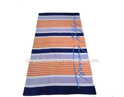 Striped beach towel with orange, purple, and navy bands laid flat with certification logos below.