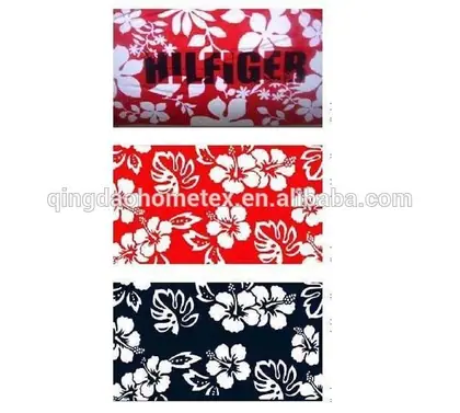 Three stacked fabric swatches with white hibiscus floral prints on red and navy backgrounds, one printed with text