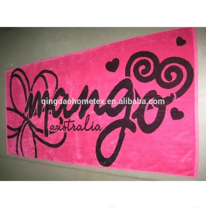 Pink towel with black text and graphic designs