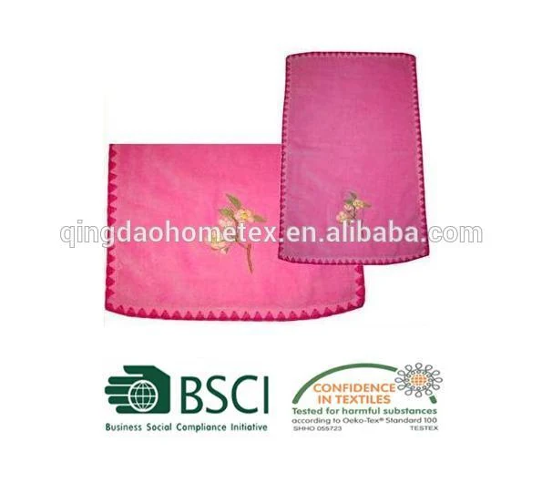 Two pink towels with floral embroidery and