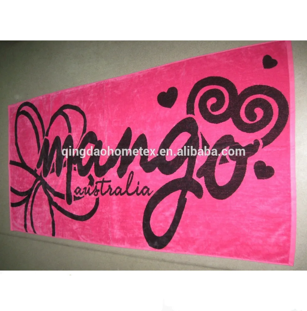 Pink towel with black text and graphic designs