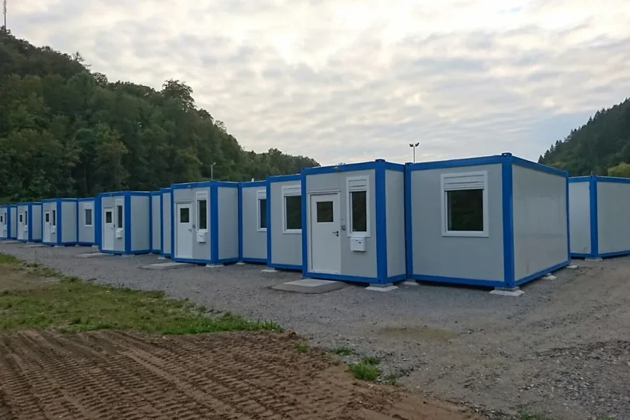 Row of container dormitory units forming a completed accommodation camp