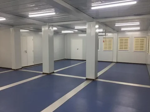 Finished sanitary block interior with washable floor and fitted partitions