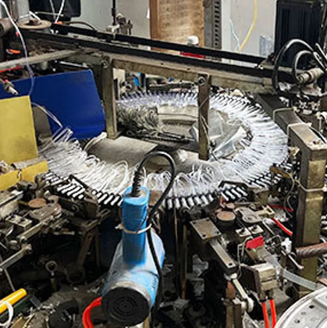 String winding in production. Consistent spacing across a run is decided here, not at final inspection.
