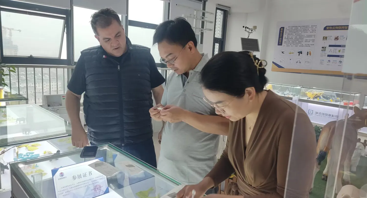 Visiting buyers handle the tags and readers in the sample room before deciding on a frequency and a 
