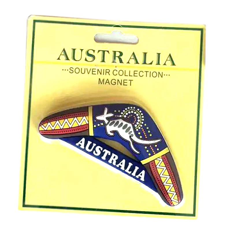 Soft PVC boomerang magnet with indigenous-style dot art on a yellow Australia souvenir collection header card