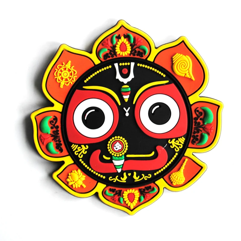 Orange and black soft PVC magnet of a painted festival mask face with large round eyes inside a lotus-shaped border