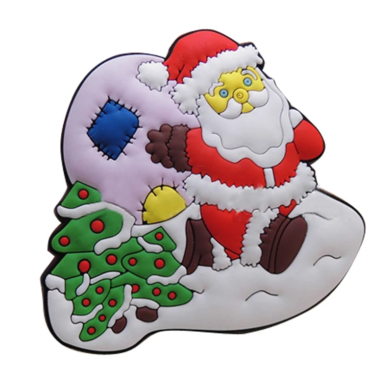Soft PVC magnet of Santa Claus in a red suit beside a decorated Christmas tree and wrapped gifts on a grey ground