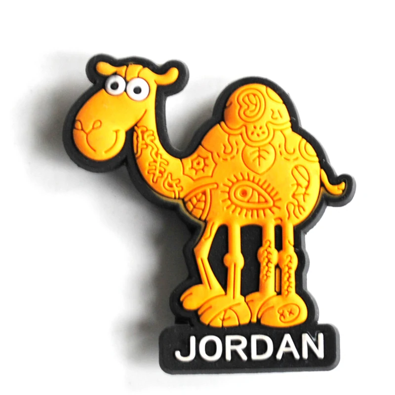 Golden yellow soft PVC magnet of a standing camel covered in engraved swirl patterns above a black Jordan name plate