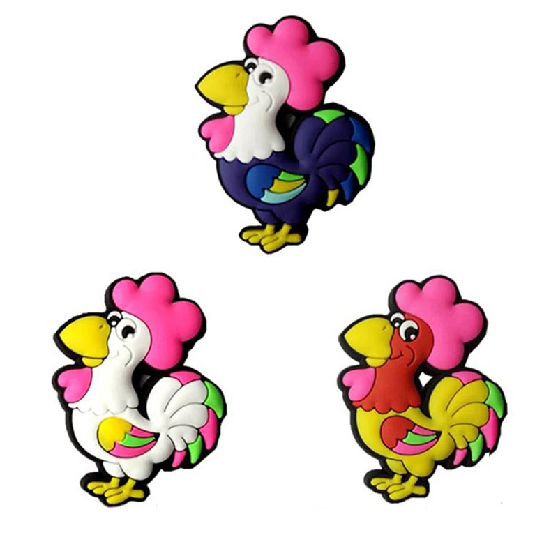 Three soft PVC rooster magnets with pink combs and white and yellow bodies forming a family set