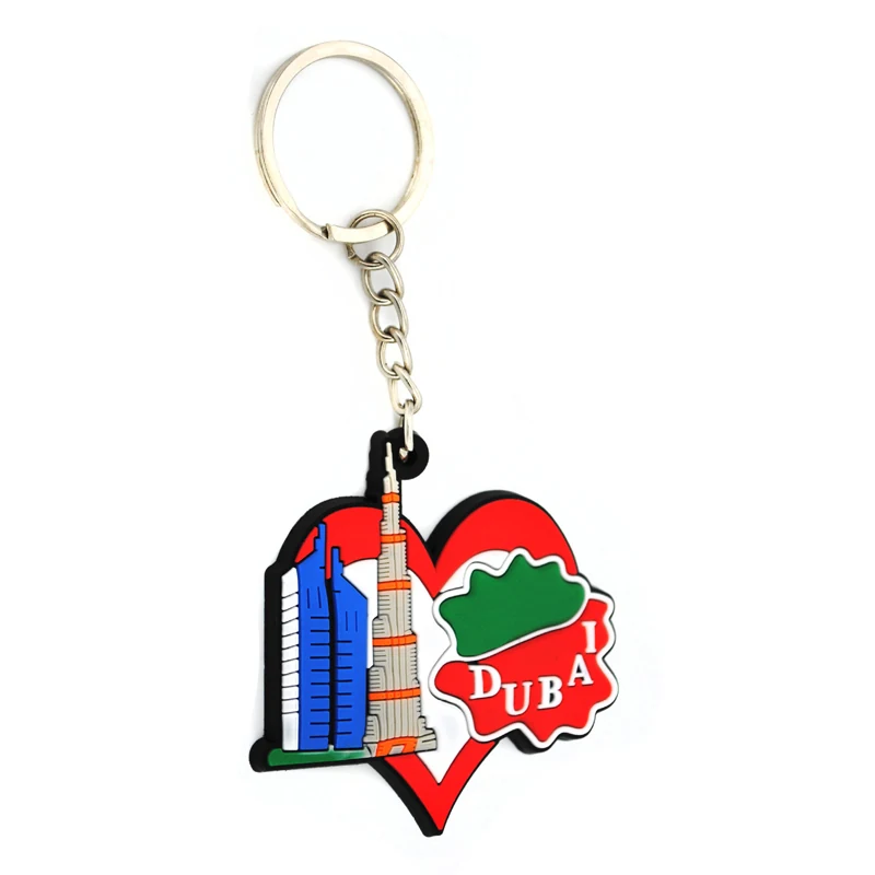 Soft PVC key chain with blue towers beside a red heart containing a green Dubai motif