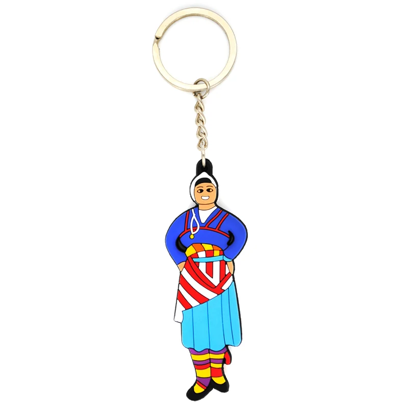 Slim soft PVC key chain of a figure in traditional folk costume with a striped skirt and braided hair