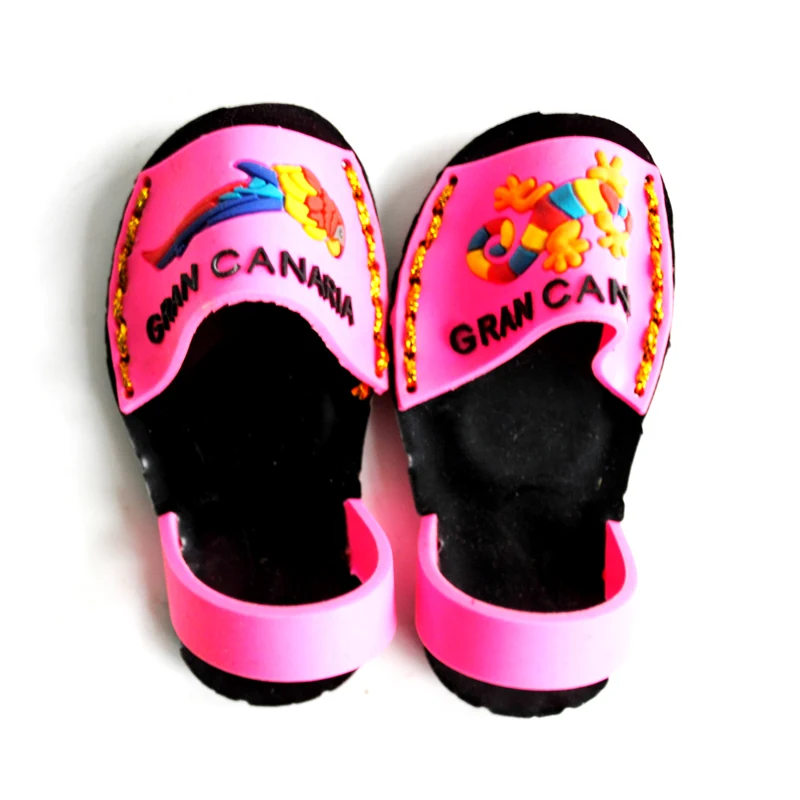 Soft PVC magnet of a pair of pink and black beach sandals with Gran Canaria lettering across the straps