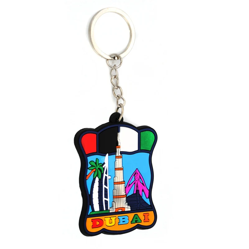Soft PVC key chain with a Dubai tower and palm trees inside a moulded frame with a split ring fitted