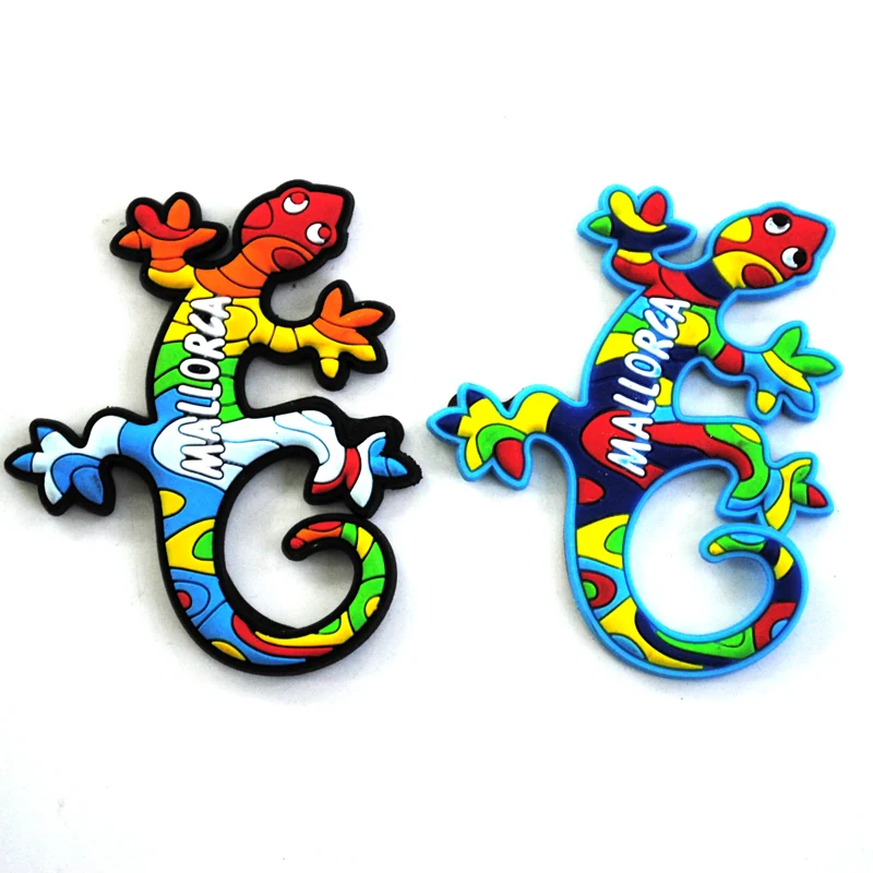 Two soft PVC gecko magnets in multicolour patterns with Mallorca lettering along the spine