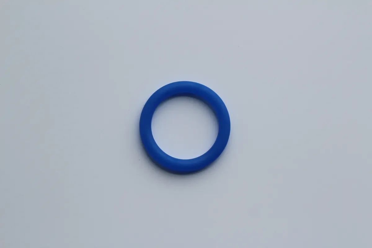 Single blue HNBR O-ring photographed on a plain light background