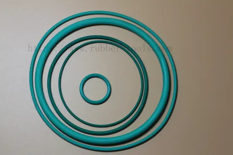 Teal O-rings of three diameters laid out concentrically