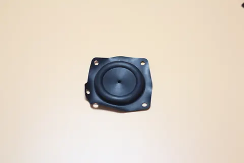 Black moulded plastic housing with a circular recess and mounting holes