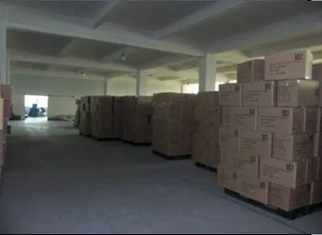 The warehouse aisle during loading. Carton count and marking are verified here before the container is filled.