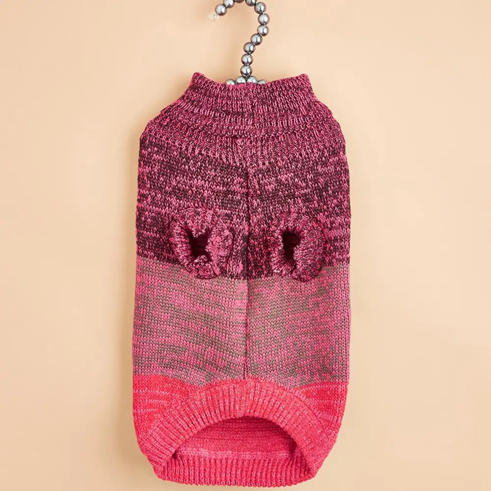 Pink and maroon striped knitted pet sweater hanging on a silver beaded hanger